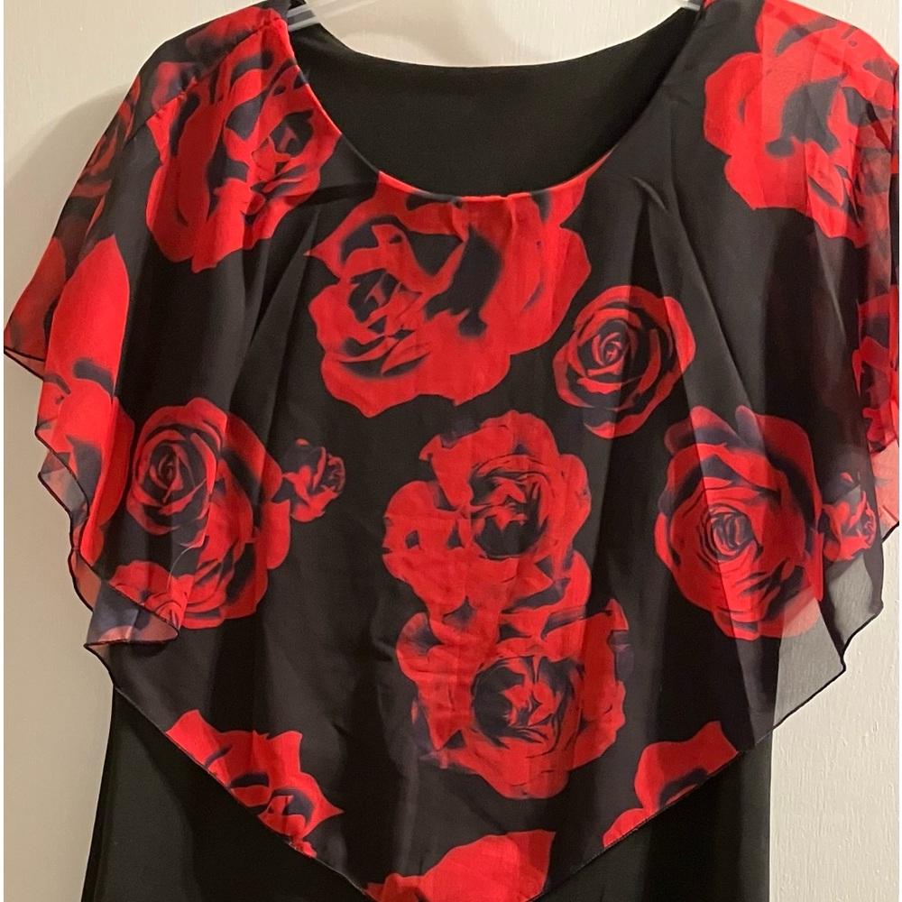 Dress size XL runs small. Never worn